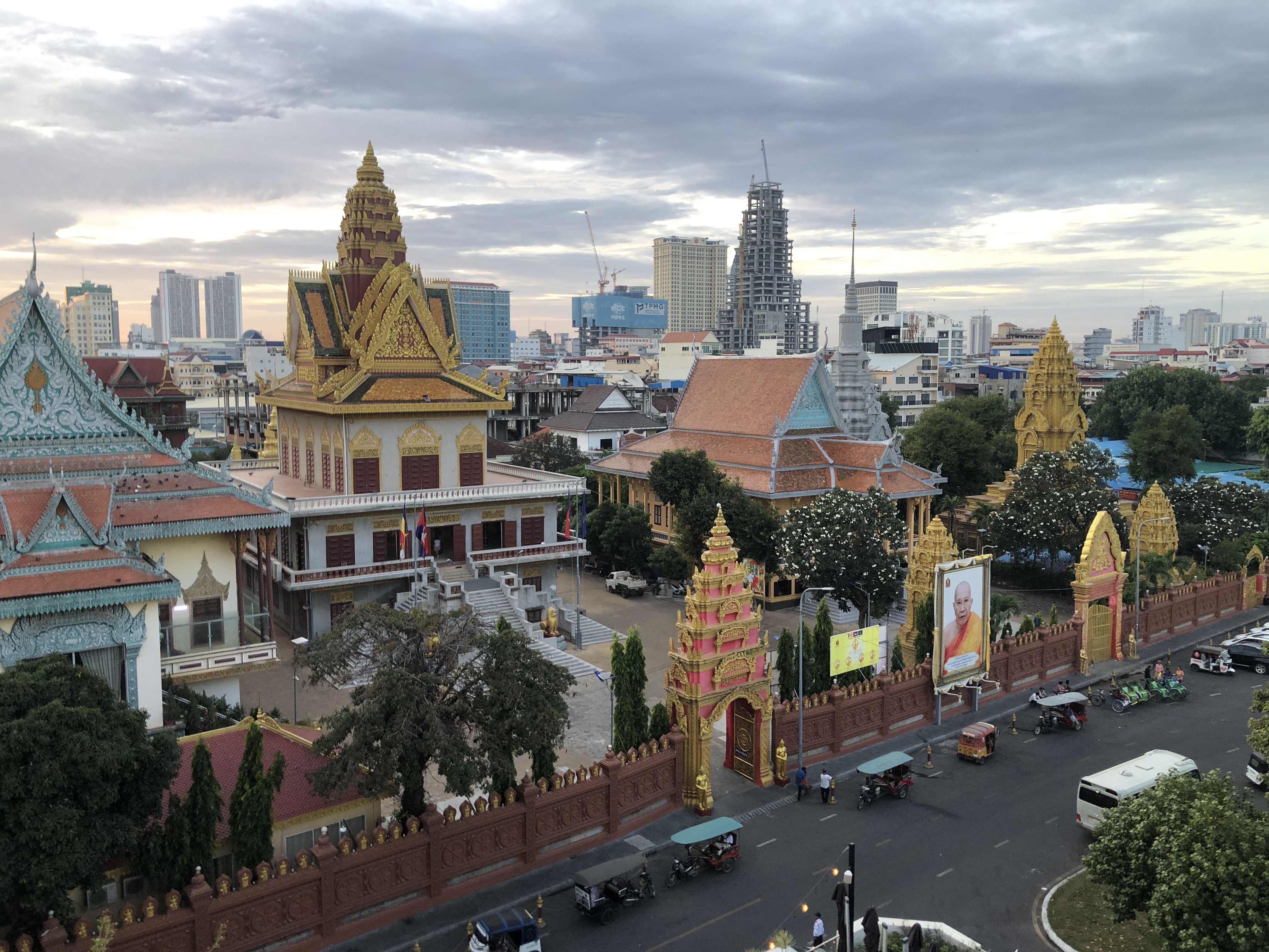 Above picture of a temple with a golden glow roof